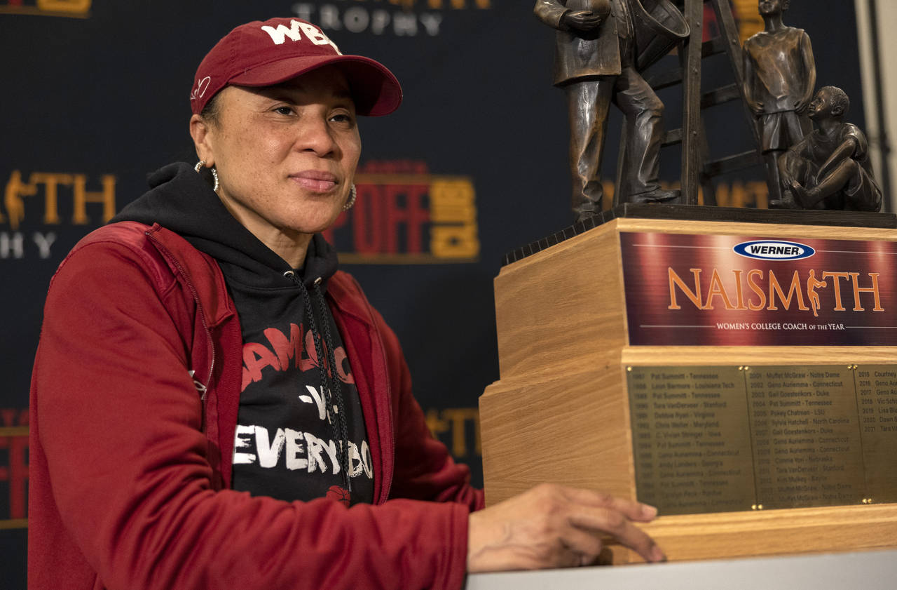 South Carolina coach Dawn Staley poses with a trophy after being named Naismith Women's College Coa...