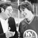 
              FILE - N.Y. Islanders coach Al Arbour, left, talks with his top scorer Mike Bossy during a break in practice in Denver, March 17, 1982. Bossy, one of hockey's most prolific goal-scorers and a star for the New York Islanders during their 1980s dynasty, died Thursday, April 14, 2022, after a battle with lung cancer. He was 65. (AP Photo/Ed Andrieski, File)
            