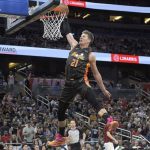 
              Orlando Magic center Moritz Wagner (21) dunks on a breakaway play during the second half of an NBA basketball game against the Cleveland Cavaliers, Tuesday, April 5, 2022, in Orlando, Fla. (AP Photo/Phelan M. Ebenhack)
            