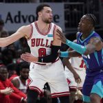 
              Chicago Bulls guard Zach LaVine, left, looks to pass against Charlotte Hornets guard Terry Rozier during the first half of an NBA basketball game in Chicago, Friday, April 8, 2022. (AP Photo/Nam Y. Huh)
            