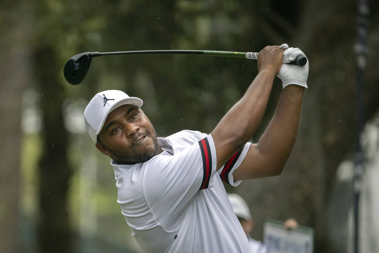 Harold Varner III watches his drive down the 16th fairway during the third round of the RBC Heritag...