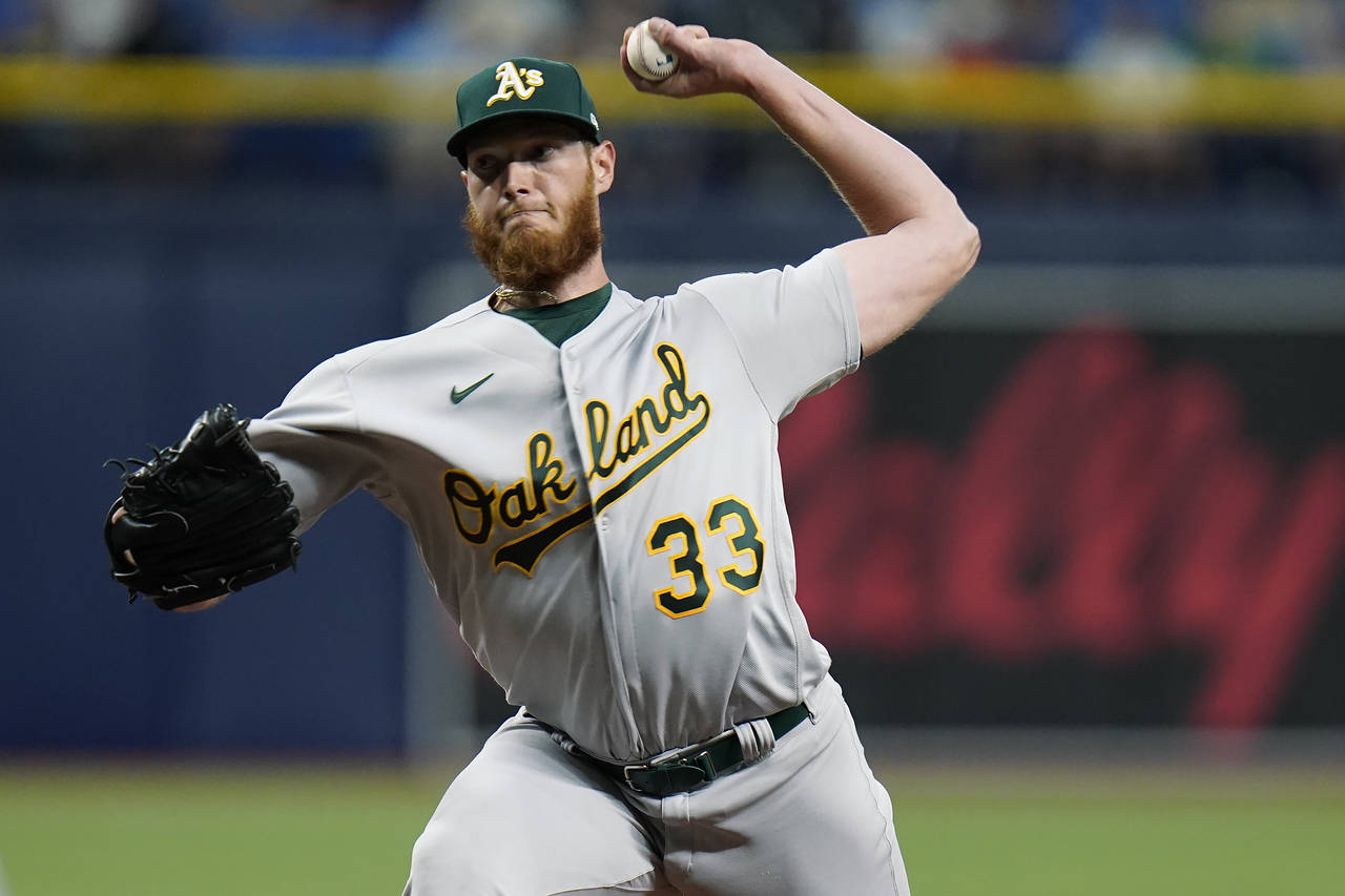 Oakland Athletics starting pitcher A.J. Puk delivers to the Tampa Bay Rays during the eighth inning...