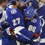 
              Tampa Bay Lightning right wing Nikita Kucherov (86) celebrates with defenseman Ryan McDonagh (27) after Kucherov scored against the Buffalo Sabres during the second period of an NHL hockey game Sunday, April 10, 2022, in Tampa, Fla. (AP Photo/Chris O'Meara)
            