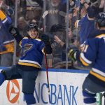 
              St. Louis Blues' Robert Thomas is congratulated by Vladimir Tarasenko (91) after scoring the game-winning goal in overtime of an NHL hockey game against the Minnesota Wild Friday, April 8, 2022, in St. Louis. (AP Photo/Jeff Roberson)
            