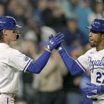 
              Kansas City Royals' Adalberto Mondesi (27) celebrates with Bobby Witt Jr. (7) after scoring on a single by Whit Merrifield during the fourth inning of a baseball game against the Detroit Tigers Thursday, April 14, 2022, in Kansas City, Mo. (AP Photo/Charlie Riedel)
            