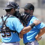 
              Miami Marlins catcher Payton Henry, left, talks with pitcher Will Stewart in the fourth inning of a spring training baseball game against the Washington Nationals, Monday, March 28, 2022, in West Palm Beach, Fla. (AP Photo/Sue Ogrocki)
            