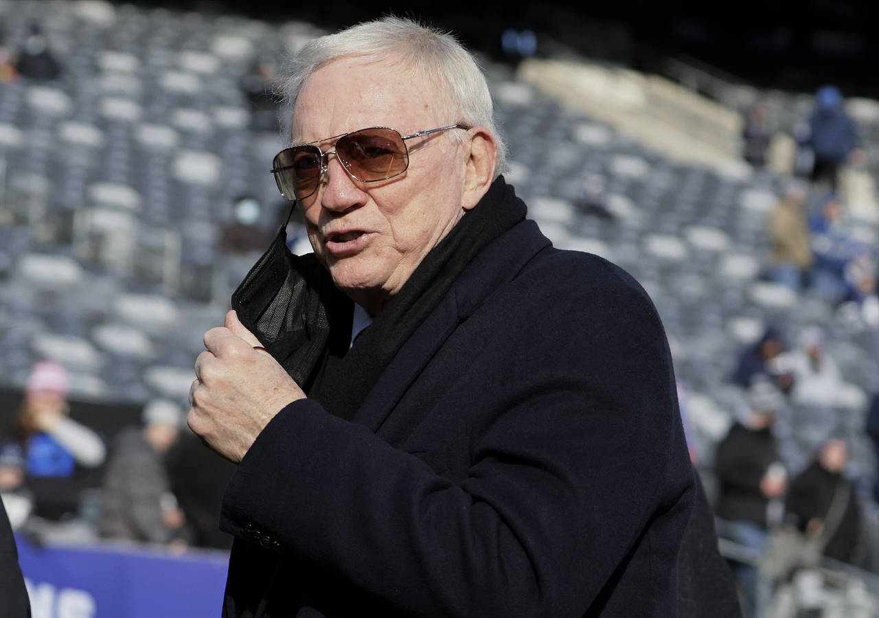 FILE - Dallas Cowboys owner Jerry Jones is seen on the field before an NFL football game between th...
