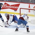 
              Winnipeg Jets' Adam Lowry's (17) shot gets past Colorado Avalanche goaltender Darcy Kuemper (35) but hits the post during second-period NHL hockey game action in Winnipeg, Manitoba, Sunday, April 24, 2022. (John Woods/The Canadian Press via AP)
            