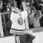 
              FILE - Mike Bossy of the New York Islanders is jubilant after scoring his 50th goal in 50 games, against the Quebec Nordiques, to tie the record held by Maurice "Rocket" Richard, at the Nassau Coliseum in Uniondale, N.Y., Jan. 24, 1981. Bossy, one of hockey’s most prolific goal-scorers and a star for the New York Islanders during their 1980s dynasty, died Thursday, April 14, 2022, after a battle with lung cancer. He was 65.= (AP Photo/Bennett, File)
            