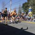 
              The elite men break from the starting line of the 126th Boston Marathon, Monday, April 18, 2022, in Hopkinton, Mass. (AP Photo/Mary Schwalm)
            