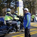 
              Race director Dave McGillivray stands at the starting line as State Police motorcycles ride past before the start of the 126th Boston Marathon, Monday, April 18, 2022, in Hopkinton, Mass. (AP Photo/Mary Schwalm)
            