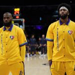 
              Los Angeles Lakers forward LeBron James, left, and forward Anthony Davis stand together before an NBA basketball game against the New Orleans Pelicans in Los Angeles, Friday, April 1, 2022. (AP Photo/Ashley Landis)
            