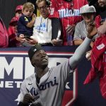 
              Miami Marlins' Jazz Chisholm Jr. signs autographs for fans after the were defeated by the Los Angeles Angels 6-2 in a baseball game Monday, April 11, 2022, in Anaheim, Calif. (AP Photo/Mark J. Terrill)
            
