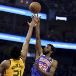 
              Golden State Warriors forward Andrew Wiggins (22) shoots against Utah Jazz center Hassan Whiteside (21) during the first half of an NBA basketball game in San Francisco, Saturday, April 2, 2022. (AP Photo/Jed Jacobsohn)
            