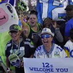 
              Seattle Seahawks fans cheer during the third day of the NFL draft Saturday, April 30, 2022, in Las Vegas. (AP Photo/John Locher)
            