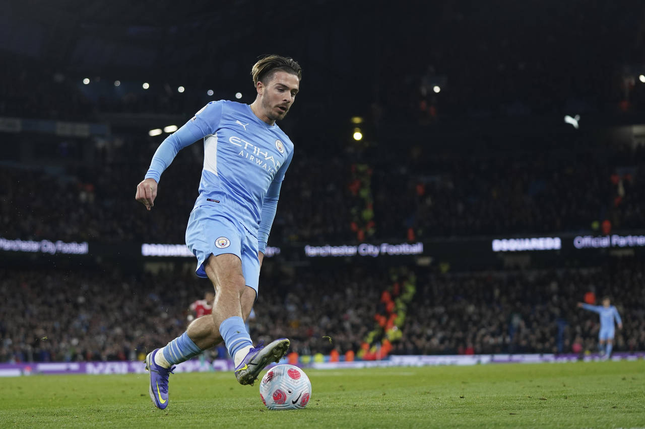 Manchester City's Jack Grealish runs with the ball during the English Premier League soccer match b...