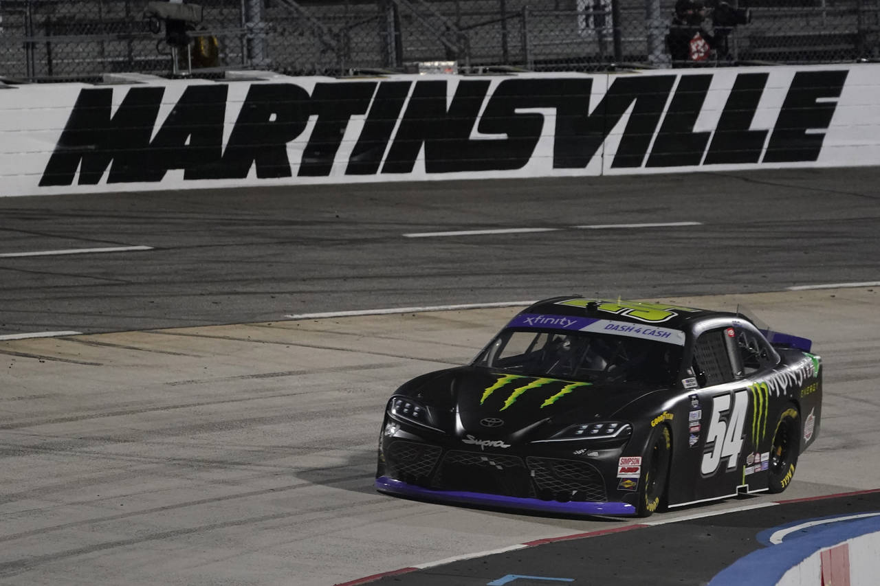 Ty Gibbs leads in Turn 4 after a restart in the NASCAR Xfinity Series auto race at Martinsville Spe...