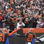 
              FILE - Cleveland Browns cornerback Denzel Ward (21) celebrates his touchdown with fans during an NFL football game against the Cincinnati Bengals, Sunday, Dec. 8, 2019, in Cleveland. The Cleveland Browns are betting on betting. The team announced a long-term partnership Tuesday, April 26, 2022, with Bally's that will make the gaming leader the official sports betting partner of the NFL team. As as part of the agreement, Bally's will have a branded lounge at FirstEnergy Stadium. (AP Photo/David Richard, File)
            