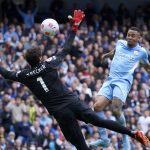 
              Manchester City's Gabriel Jesus, right, scores his side's second goal during the English Premier League soccer match between Manchester City and Liverpool, at the Etihad stadium in Manchester, England, Sunday, April 10, 2022. (AP Photo/Jon Super)
            