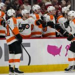 
              Philadelphia Flyers left wing James van Riemsdyk (25) is congratulated for his first-period goal in the team's NHL hockey game Washington Capitals, Tuesday, April 12, 2022, in Washington. (AP Photo/Alex Brandon)
            
