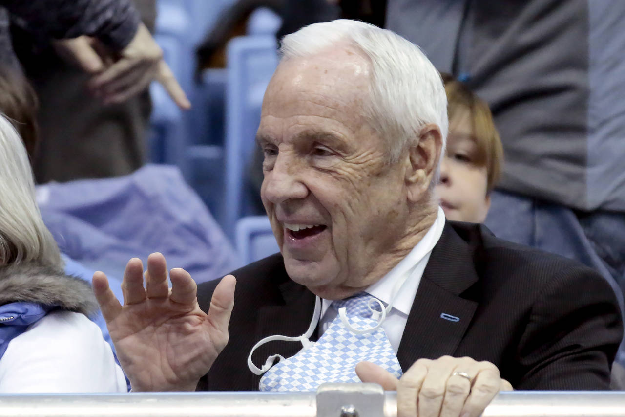 FILE - Former North Carolina head basketball coach Roy Williams waves to fans before the start of o...