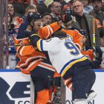 
              St. Louis Blues' Ryan O'Reilly (90) and Edmonton Oilers' Darnell Nurse (25) rough it up during the third period of an NHL hockey game Friday, April 1, 2022, in Edmonton, Alberta. (Jason Franson/The Canadian Press via AP)
            