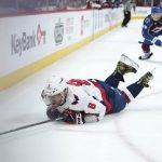 
              Washington Capitals left wing Alex Ovechkin (8) slides on the ice after being tripped by Colorado Avalanche center Nico Sturm (78) during the second period of an NHL hockey game Monday, April 18, 2022, in Denver. (AP Photo/Jack Dempsey)
            