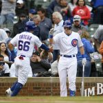 
              Chicago Cubs' Rafael Ortega (66) celebrates with teammate Frank Shwindel, right, after scoring on an error during the first inning of a baseball game against the Pittsburgh Pirates, Sunday, April 24, 2022, in Chicago. (AP Photo/Paul Beaty)
            