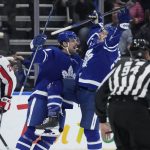 
              Toronto Maple Leafs left wing Michael Bunting, right, celebrates his goal against the Washington Capitals with center Auston Matthews (34) during the first period of an NHL hockey game Thursday, April 14, 2022, in Toronto. (Frank Gunn/The Canadian Press via AP)
            