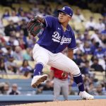 
              Los Angeles Dodgers starting pitcher Julio Urias throws to the plate during the first inning of a spring training baseball game against the Los Angeles Angels Monday, April 4, 2022, in Los Angeles. (AP Photo/Mark J. Terrill)
            