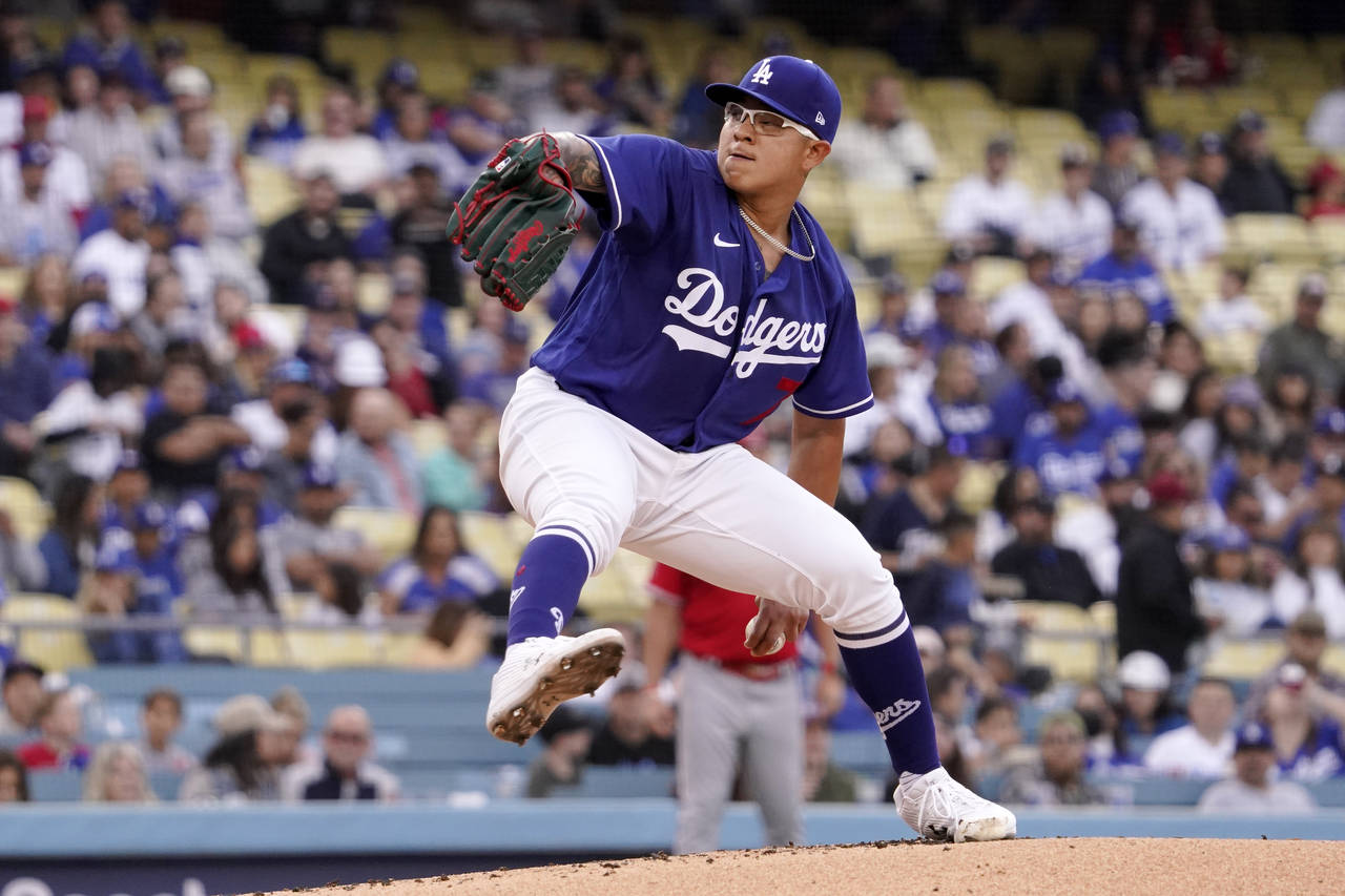 Los Angeles Dodgers starting pitcher Julio Urias throws to the plate during the first inning of a s...