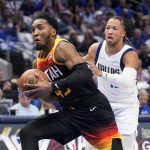 
              Utah Jazz guard Donovan Mitchell (45) drives to the basket past Dallas Mavericks guard Jalen Brunson, right, in the first half of Game 2 of an NBA basketball first-round playoff series, Monday, April 18, 2022, in Dallas. (AP Photo/Tony Gutierrez)
            