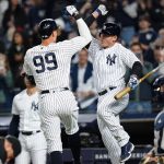 
              New York Yankees' Aaron Judge, left, celebrates with Anthony Rizzo after hitting a home run during the fifth inning of the team's baseball game against the Cleveland Guardians on Friday, April 22, 2022, in New York. (AP Photo/Frank Franklin II)
            