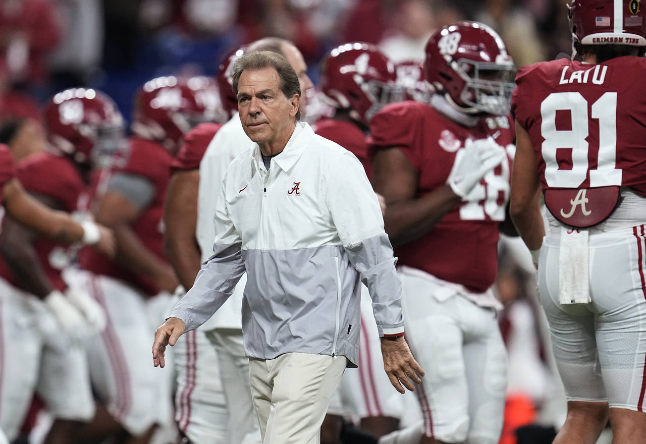 FILE - Alabama coach Nick Saban watches players warm up for the College Football Playoff championsh...