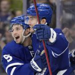 
              Toronto Maple Leafs left wing Pierre Engvall, right, celebrates his goal with teammate Alexander Kerfoot during the second period of an NHL hockey game, in Toronto, Sunday, April 17, 2022. (Frank Gunn/The Canadian Press via AP)
            