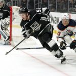 
              Los Angeles Kings defenseman Troy Stecher, left, moves the puck while being followed by Edmonton Oilers right wing Jesse Puljujarvi during the third period of an NHL hockey game Thursday, April 7, 2022, in Los Angeles. (AP Photo/Mark J. Terrill)
            