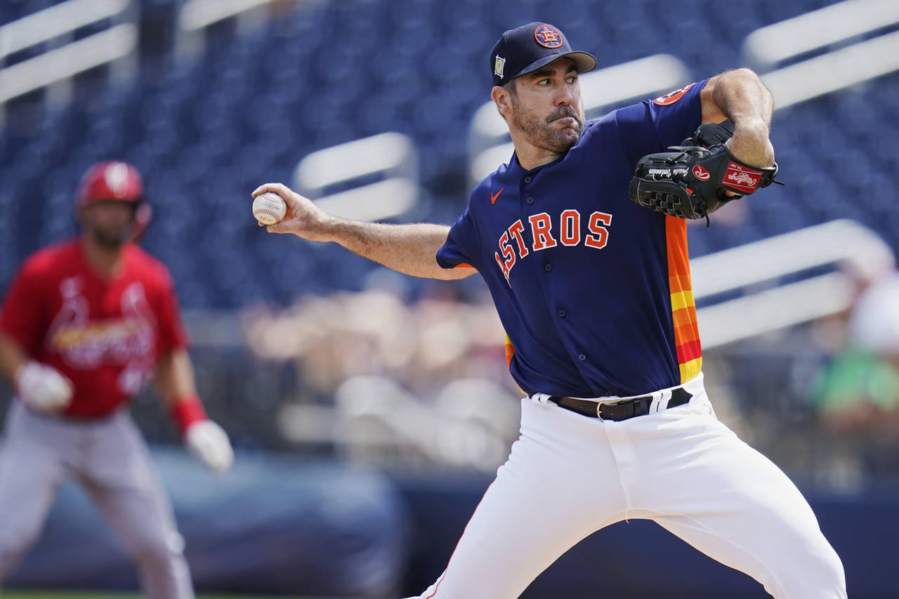 Houston Astros starting pitcher Justin Verlander pitches in the first inning of a spring training b...