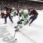 
              Dallas Stars' Roope Hintz (24) is chased by Edmonton Oilers' Cody Ceci (5) during the third period of an NHL hockey game Wednesday, April 20, 2022, in Edmonton, Alberta. (Jason Franson/The Canadian Press via AP)
            
