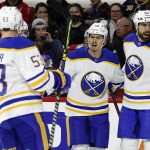 
              Buffalo Sabres' Jacob Bryson (78), Jeff Skinner (53) celebrate with Alex Tuch (89), who scored during the first period of the team's NHL hockey game against the Carolina Hurricanes in Raleigh, N.C., Thursday, April 7, 2022. (AP Photo/Karl B DeBlaker)
            