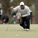 
              Tiger Woods prepares to putt on the third green during the third round of the Masters golf tournament at Augusta National on Saturday, April 9, 2022, in Augusta, Ga. (Jason Getz/Atlanta Journal-Constitution via AP)
            