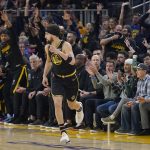 
              Golden State Warriors guard Klay Thompson reacts after shooting a 3-point basket against the Denver Nuggets during the first half of Game 1 of an NBA basketball first-round playoff series in San Francisco, Saturday, April 16, 2022. (AP Photo/Jeff Chiu)
            