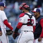 
              Washington Nationals starting pitcher Josh Rogers, second from left, is removed by manager Dave Martinez, right, during the fifth inning of the team's baseball game against the Arizona Diamondbacks at Nationals Park, Thursday, April 21, 2022, in Washington. (AP Photo/Alex Brandon)
            