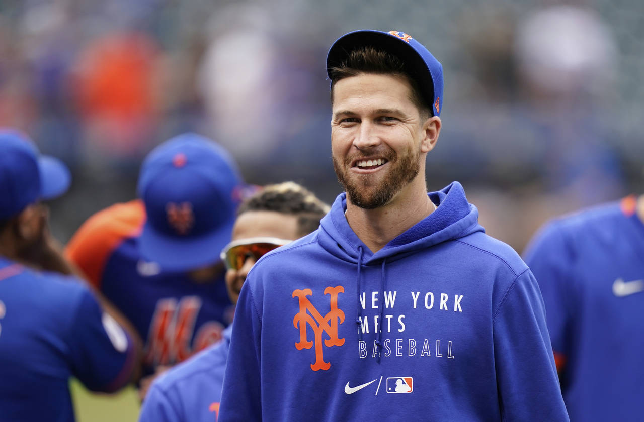 FILE - New York Mets pitcher Jacob DeGrom smiles after the team's baseball game against the Washing...