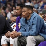 
              Los Angeles Lakers guards Russell Westbrook, front, and Malik Monk look on from the bench in the first half of an basketball game against the Denver Nuggets Sunday, April 10, 2022, in Denver. (AP Photo/David Zalubowski)
            