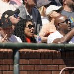 
              San Francisco Giants CEO and President Larry Baer, from left, sits with Mayor London Breed and former player Barry Bonds during a baseball game between the Giants and the Miami Marlins in San Francisco, Friday, April 8, 2022. (AP Photo/Eric Risberg)
            
