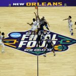 
              Villanova and Kansas tip off their college basketball game during the semifinal round of the Men's Final Four NCAA tournament, Saturday, April 2, 2022, in New Orleans. (AP Photo/David J. Phillip)
            
