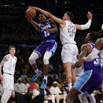 
              Los Angeles Lakers guard Malik Monk (11) shoots against Oklahoma City Thunder forward Isaiah Roby (22) during the first half of an NBA basketball game in Los Angeles, Friday, April 8, 2022. (AP Photo/Ashley Landis)
            