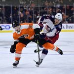 
              Philadelphia Flyers' Patrick Brown, left, and Columbus Blue Jackets' Adam Boqvist race for the puck during the third period of an NHL hockey game Tuesday, April 5, 2022, in Philadelphia. The Blue Jackets won 4-2. (AP Photo/Derik Hamilton)
            