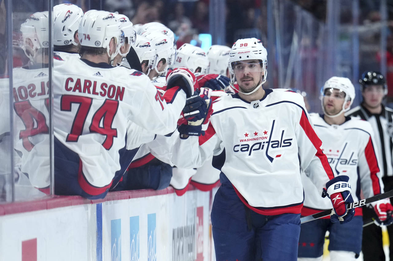 Washington Capitals left wing Marcus Johansson (90) celebrates a goal with teammates on the bench d...
