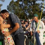 
              Scottie Scheffler kisses his wife Meredith Scudder after winning the 86th Masters golf tournament on Sunday, April 10, 2022, in Augusta, Ga. (AP Photo/David J. Phillip)
            